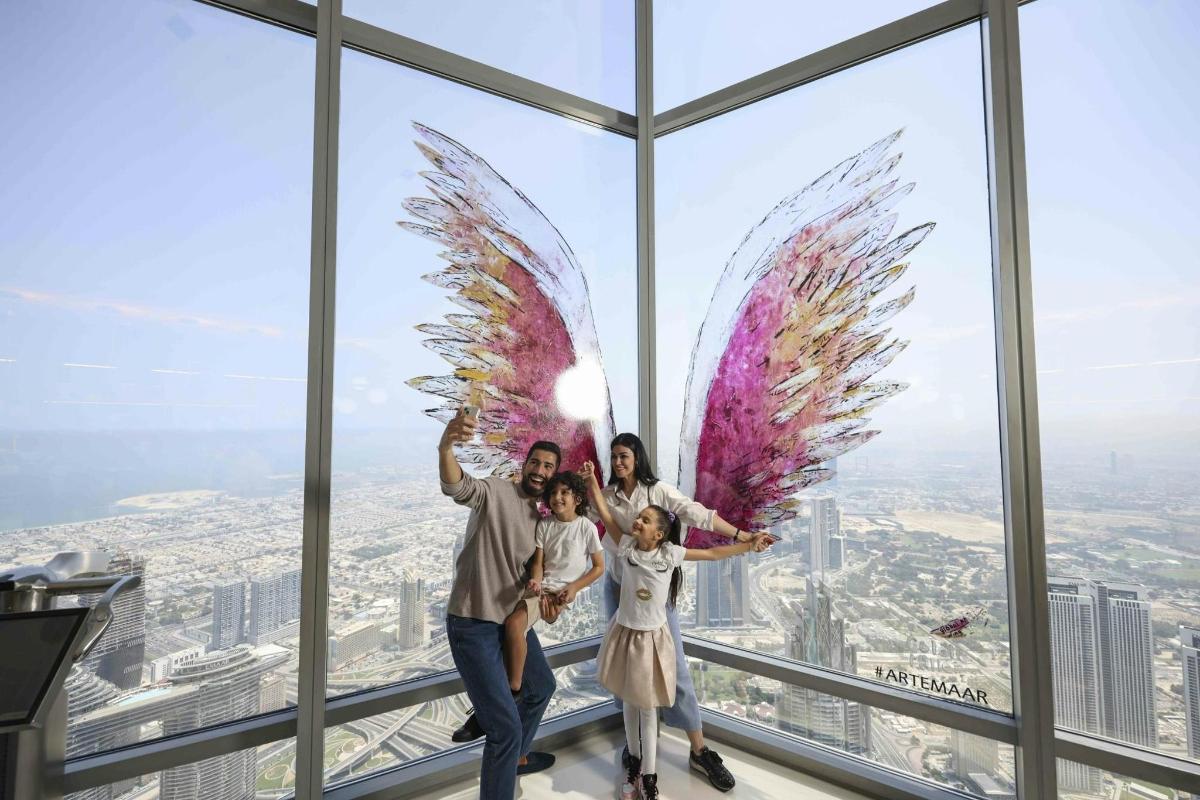 a group of people with wings in the sky scrapper