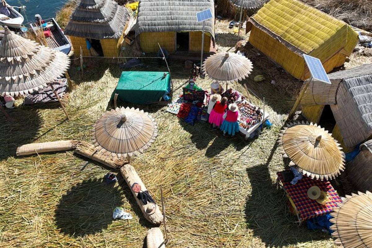 a toy play set with a group of people and umbrellas