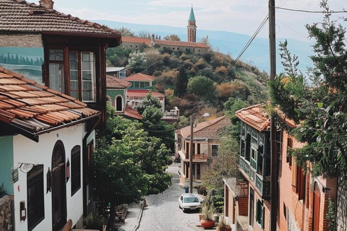 a city street with houses and a church