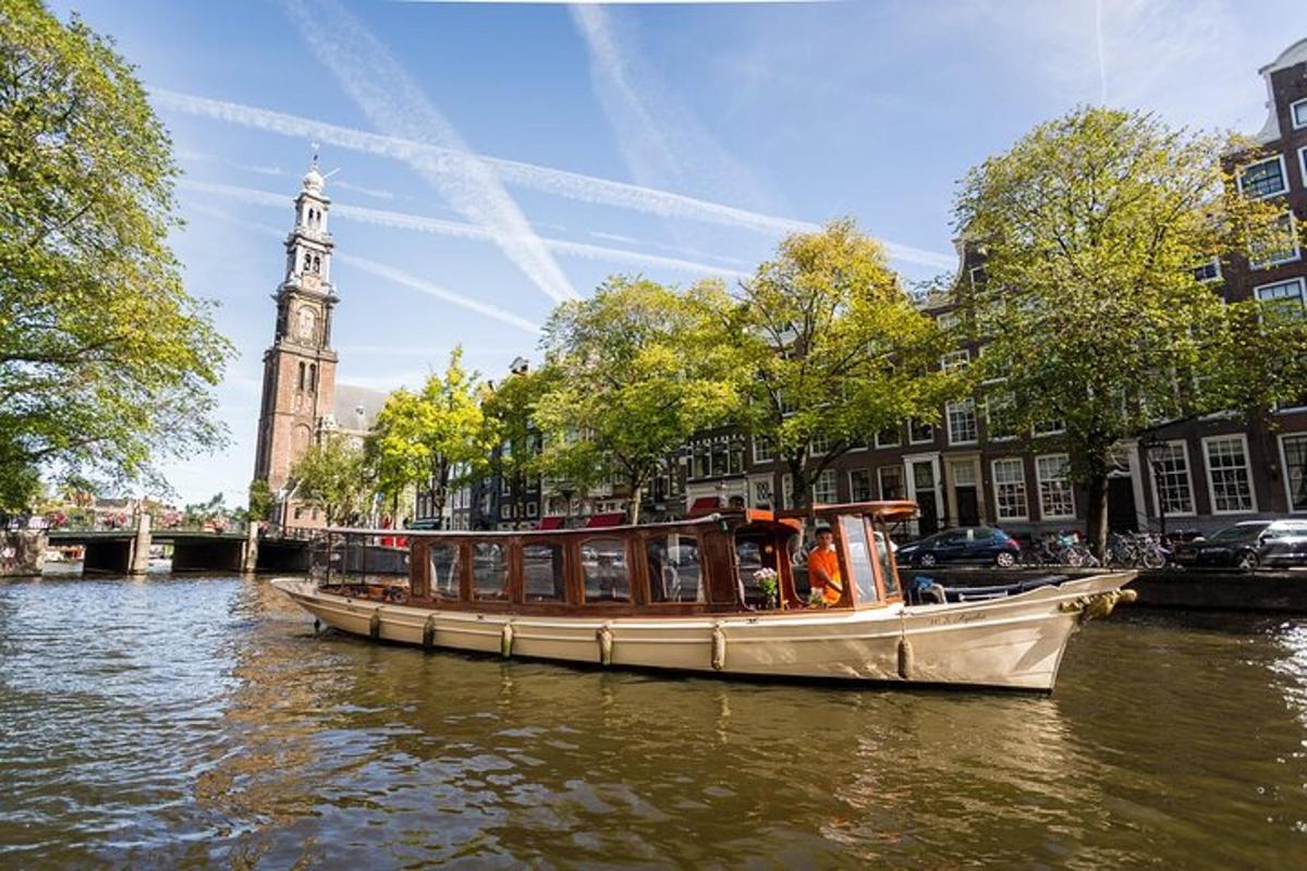 a boat on a river with a clock tower