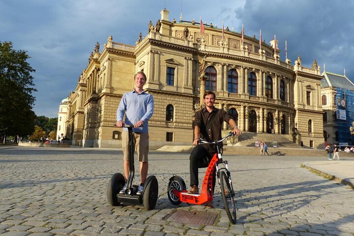 two men riding on segifts in front of a building