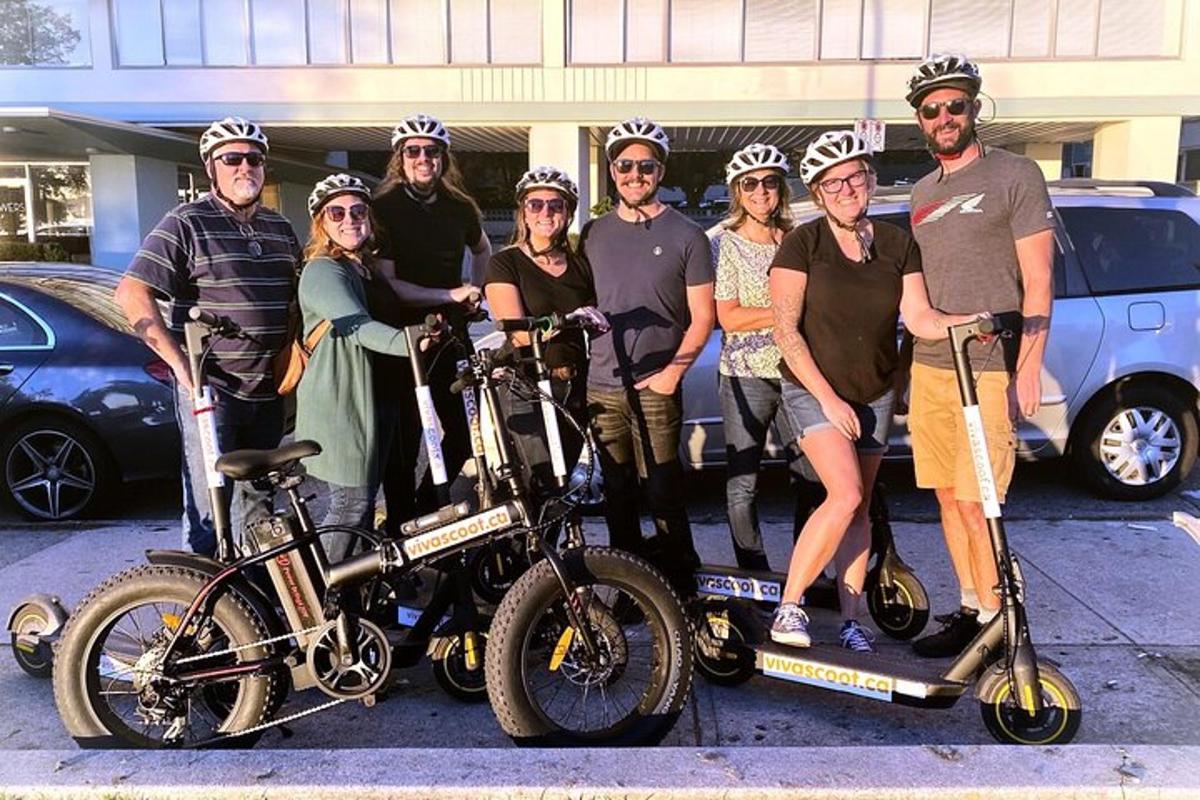 a group of people posing for a picture with their bikes