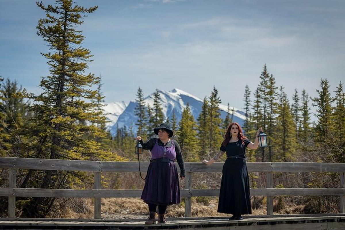 two women in victorian clothing standing on a bridge