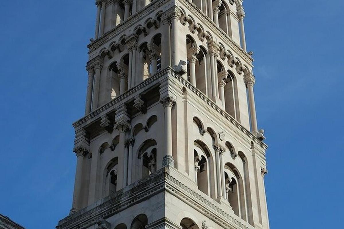 a tall clock tower with a blue sky in the background