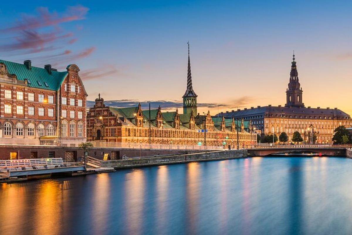 a city with a river in front of buildings