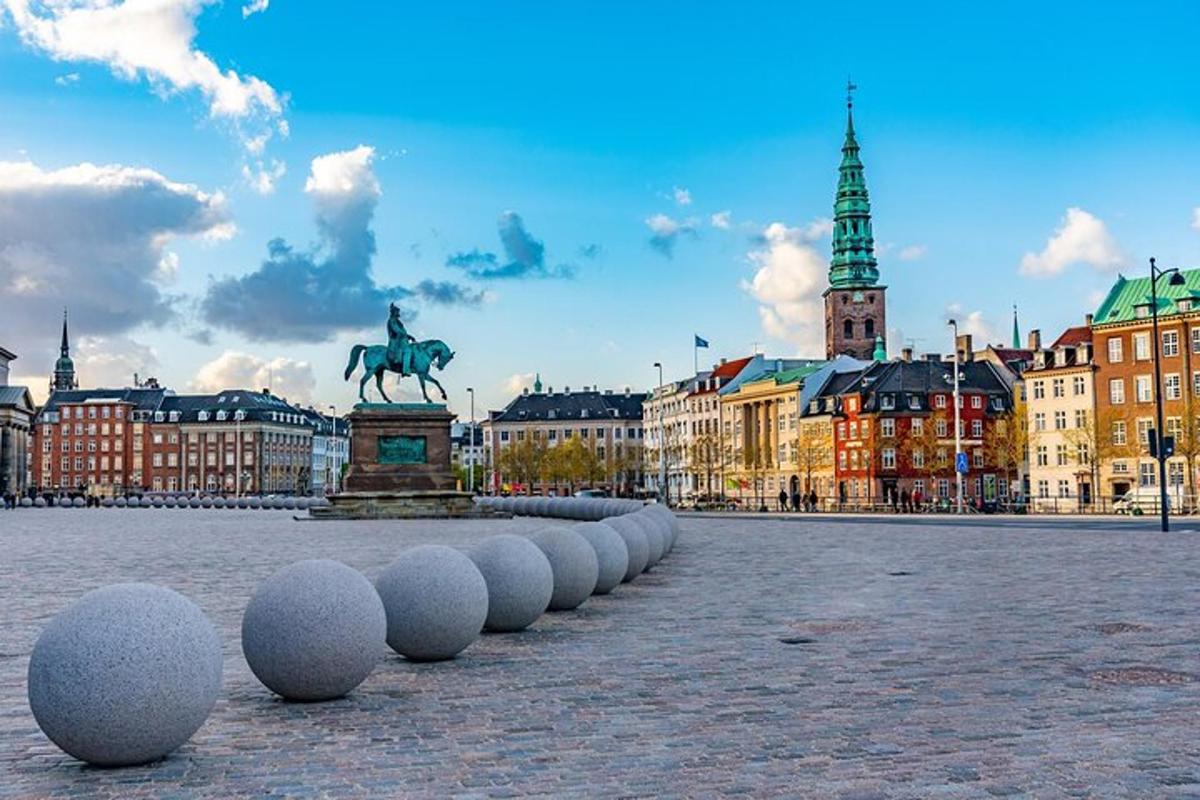a city with a statue of a man on a horse