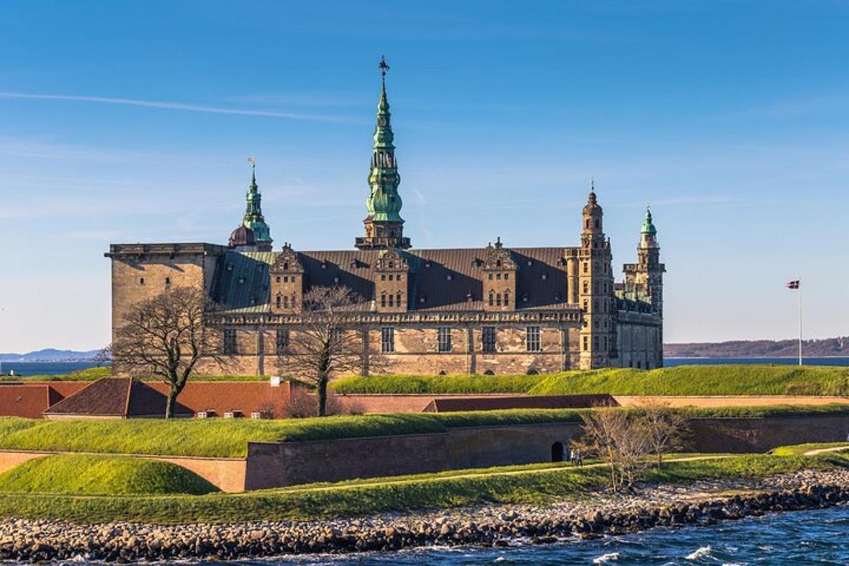 a large castle with a river in front of it