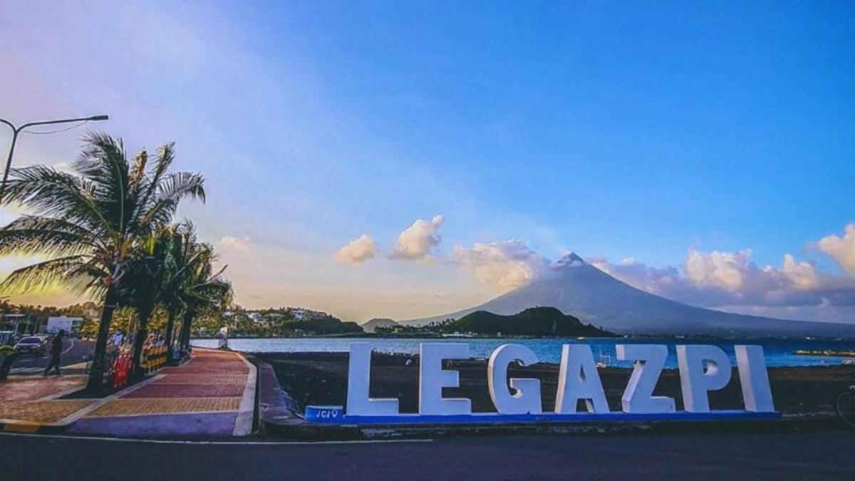 a sign that reads lepreop with a mountain in the background