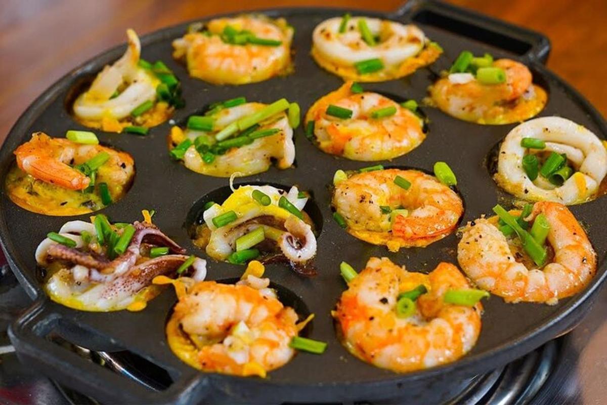 a tray of food with shrimp and vegetables on it