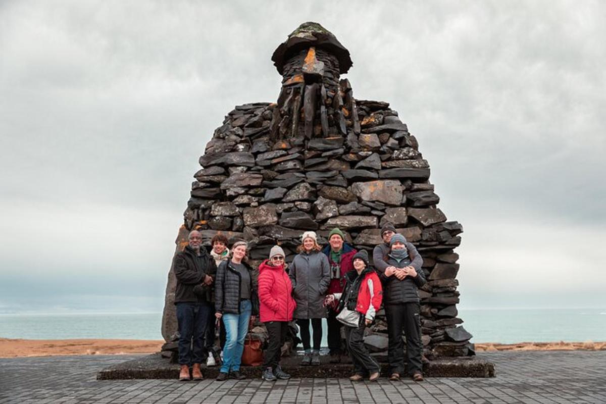 a group of people standing in front of a monument