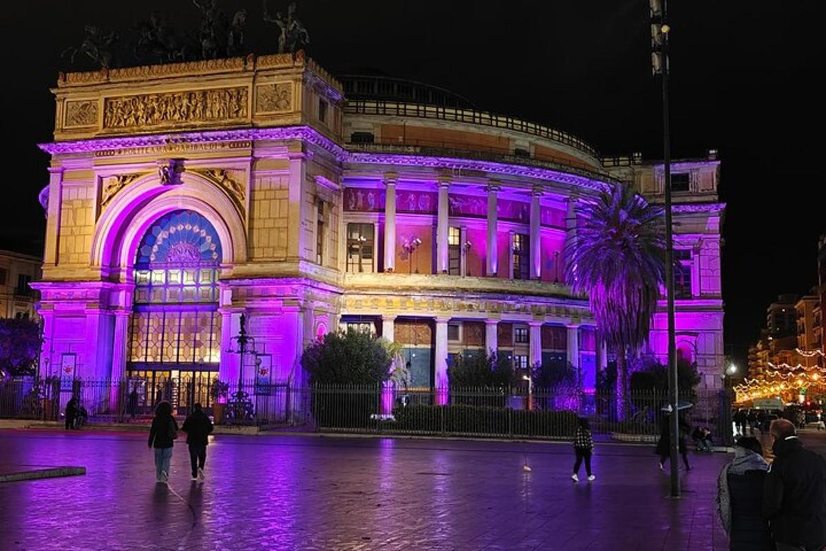 a building is lit up with purple lights
