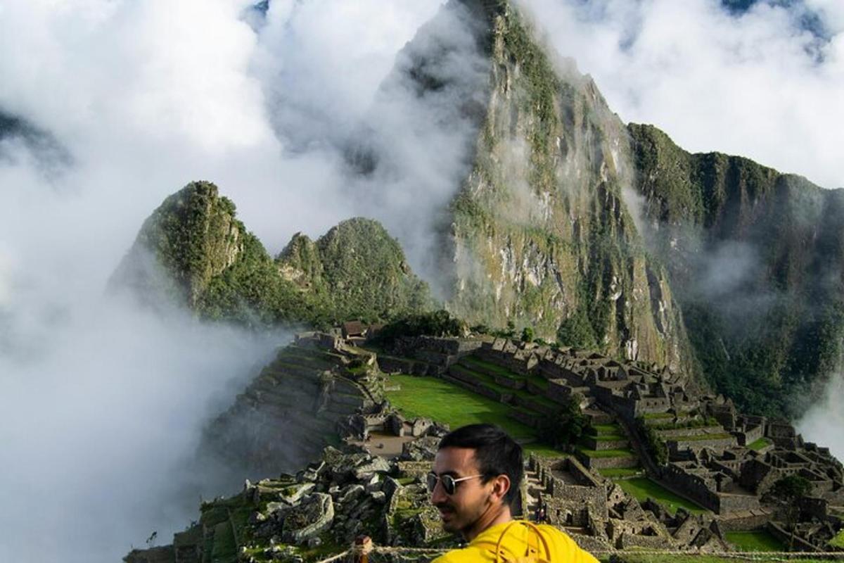 a man standing in front of a mountain