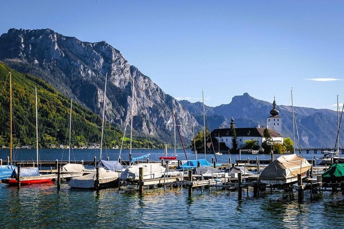 a bunch of boats docked at a dock in the water