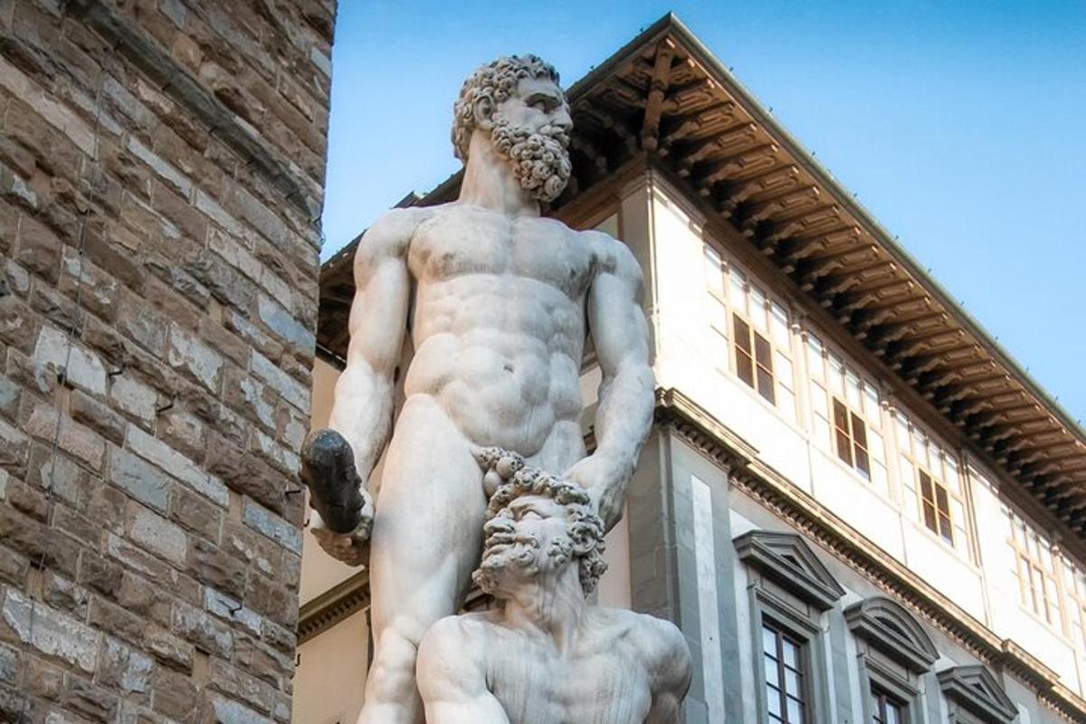 a statue of a man standing in front of a building