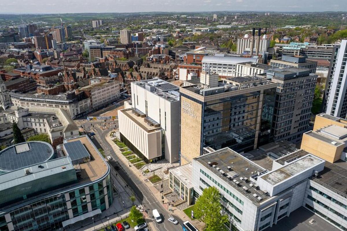 an aerial view of a city with tall buildings