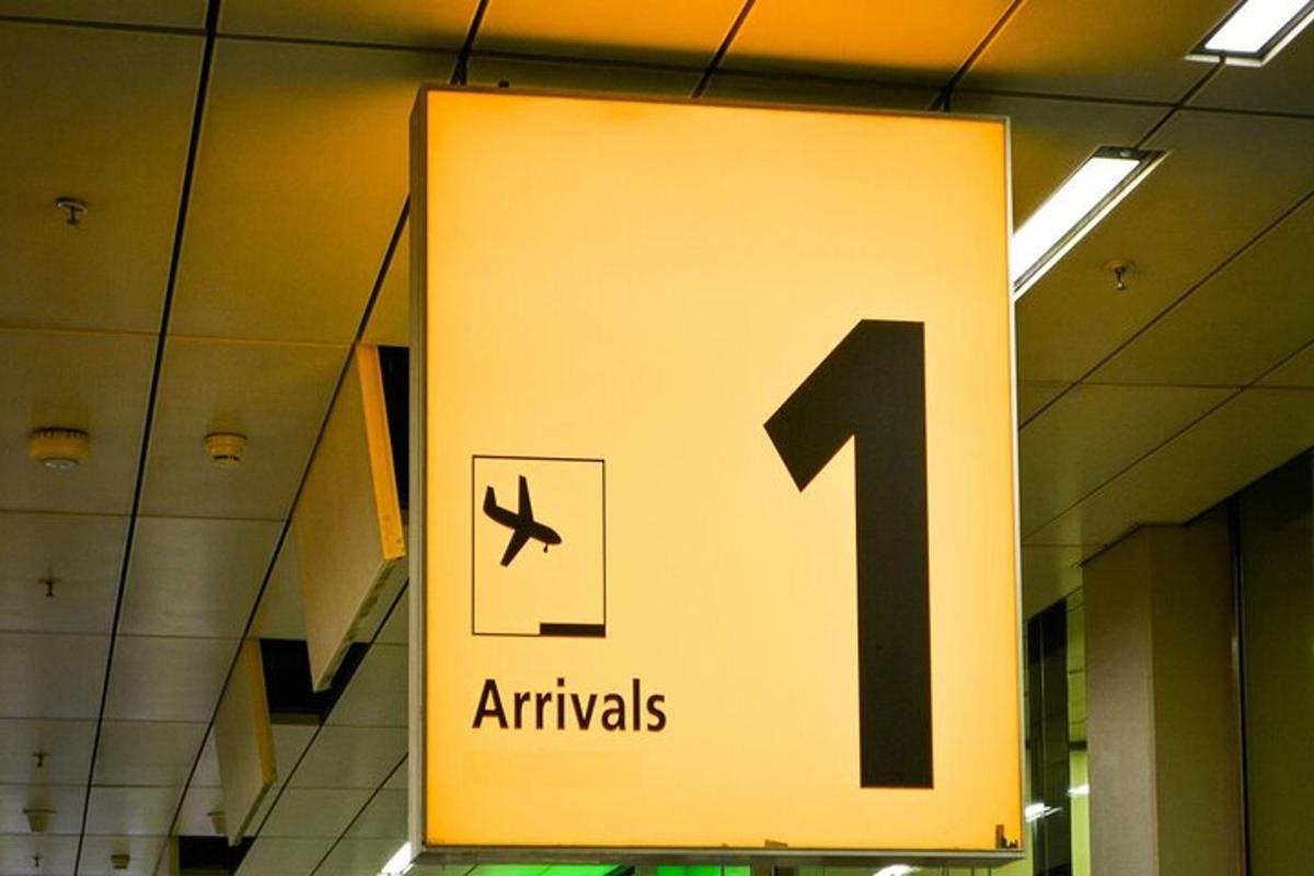 a sign in an airport with an airplane on it