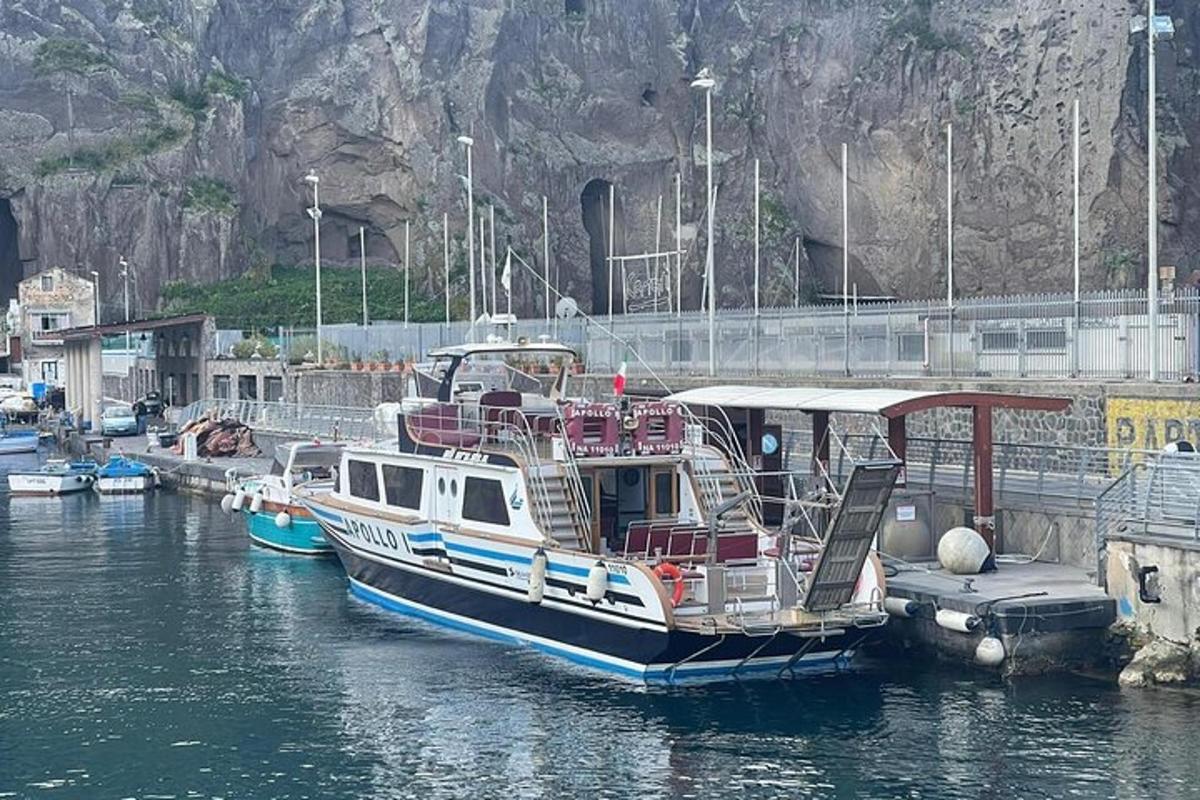a boat is docked at a dock in the water