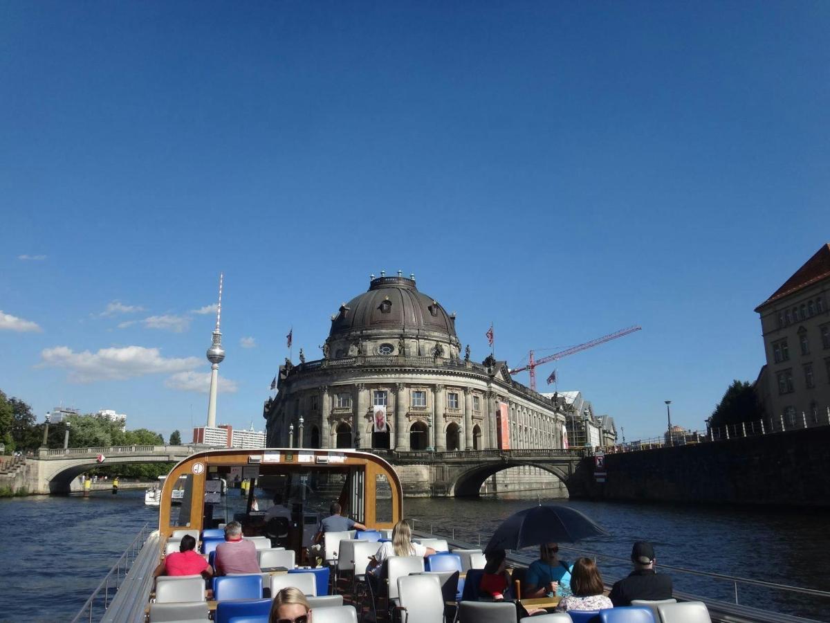 a group of people sitting on a boat in the water