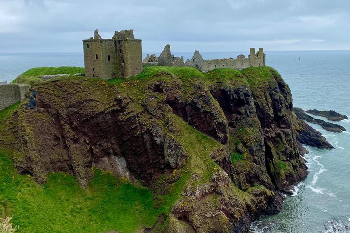 a castle on top of a cliff near the ocean