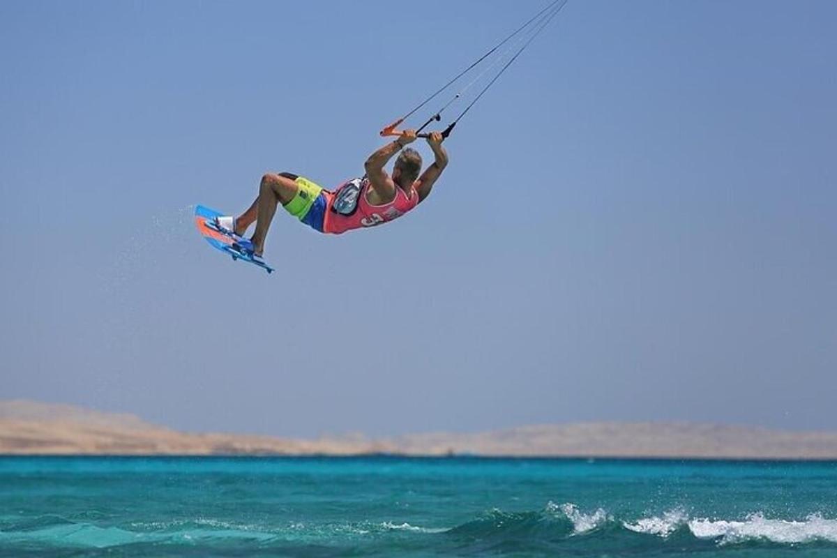 a person on a board in the air over the ocean