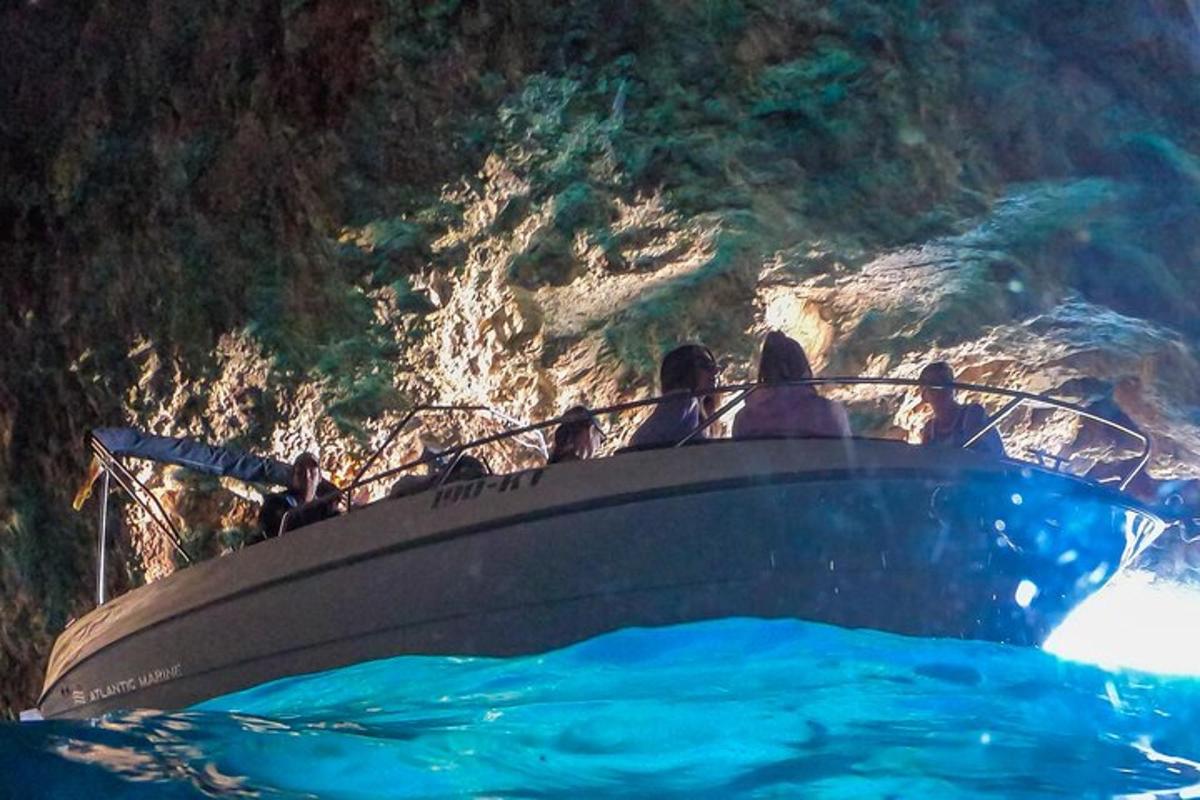 a group of people on a boat in the water