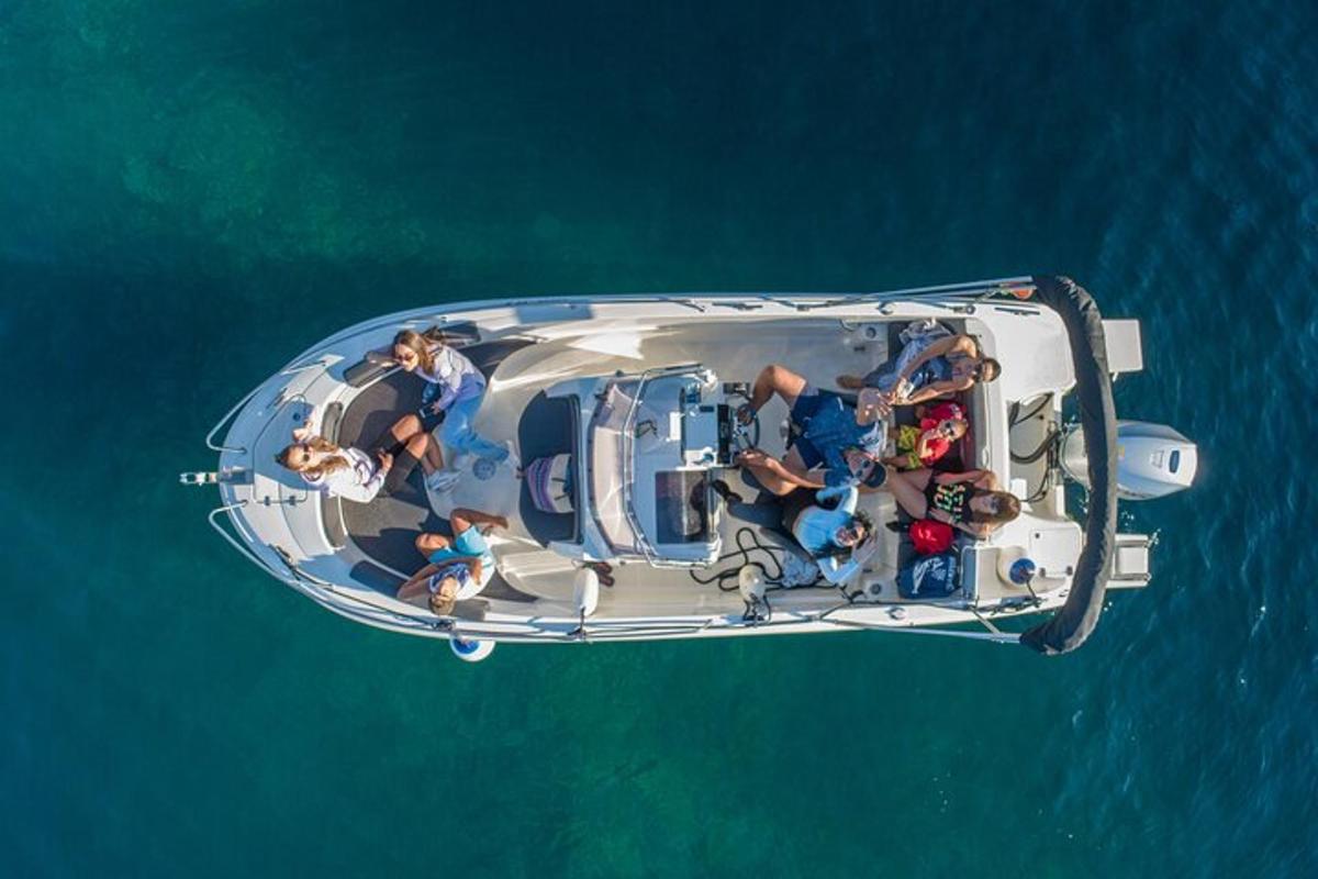a group of people on a boat in the water