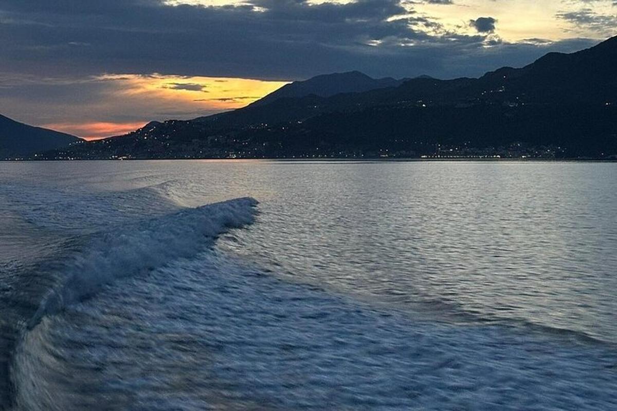 a boat in a body of water at sunset
