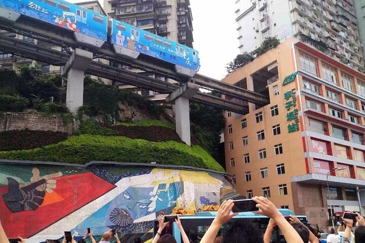 a crowd of people taking pictures of a bridge