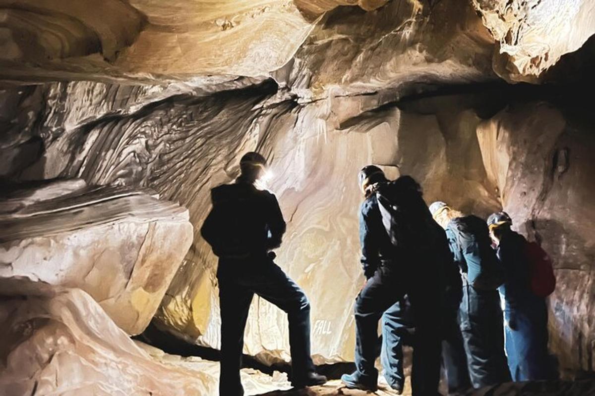 a group of people standing in a cave
