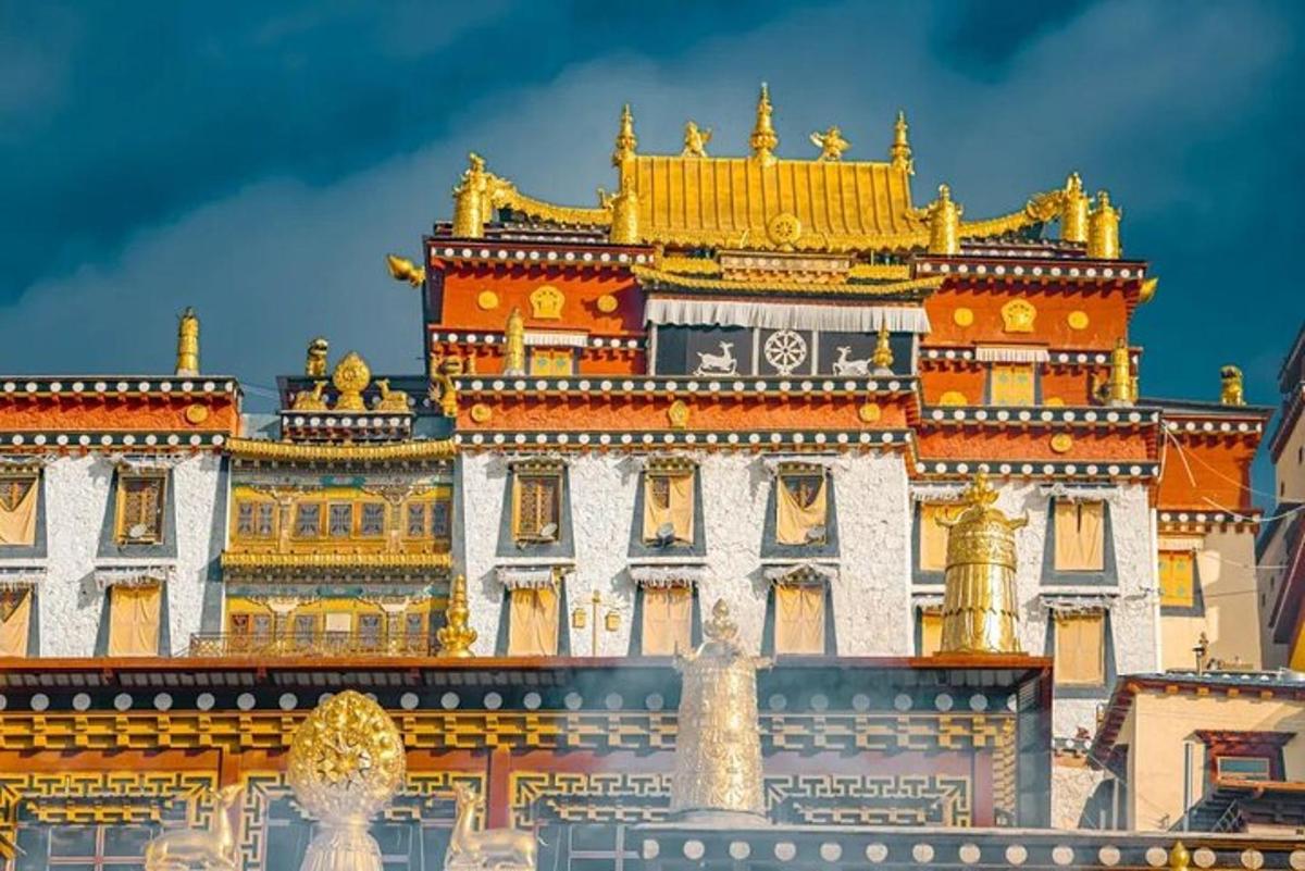 a large building with gold domes on top of it