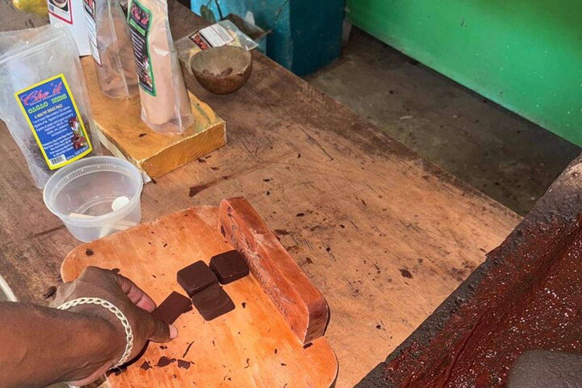 a person is standing on a wooden cutting board