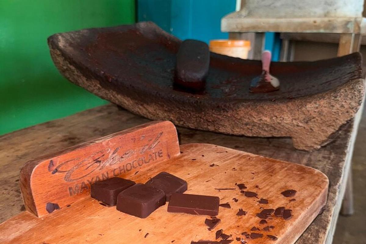 a pile of chocolate on a wooden cutting board