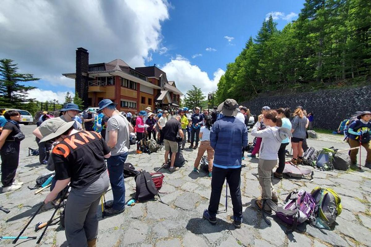 a large group of people standing around in front of a building