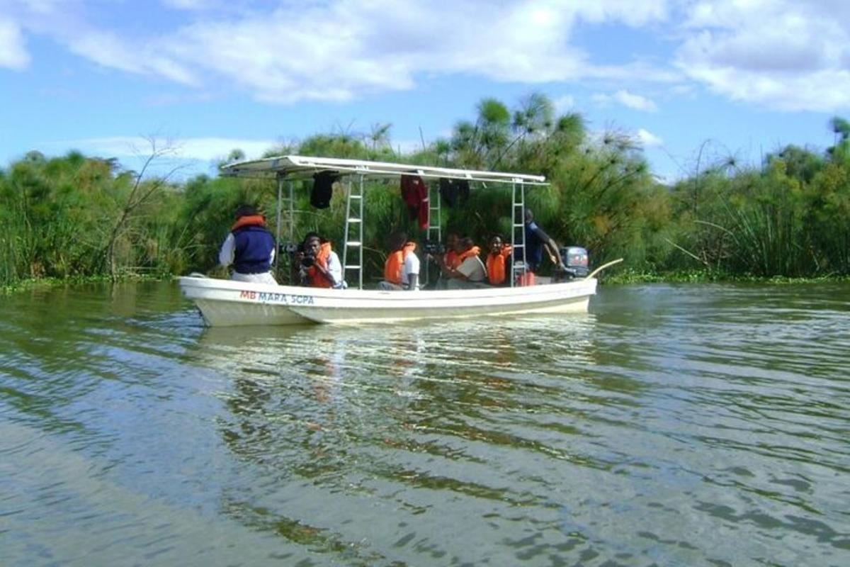a group of people in a boat on the water