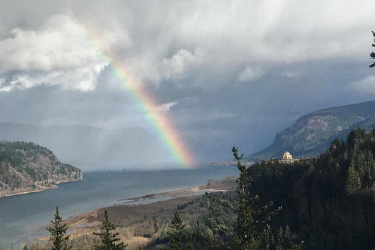 a rainbow over a body of water with