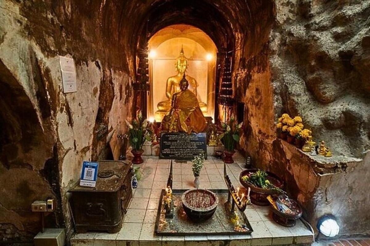 a temple with a statue in a room with a shrine