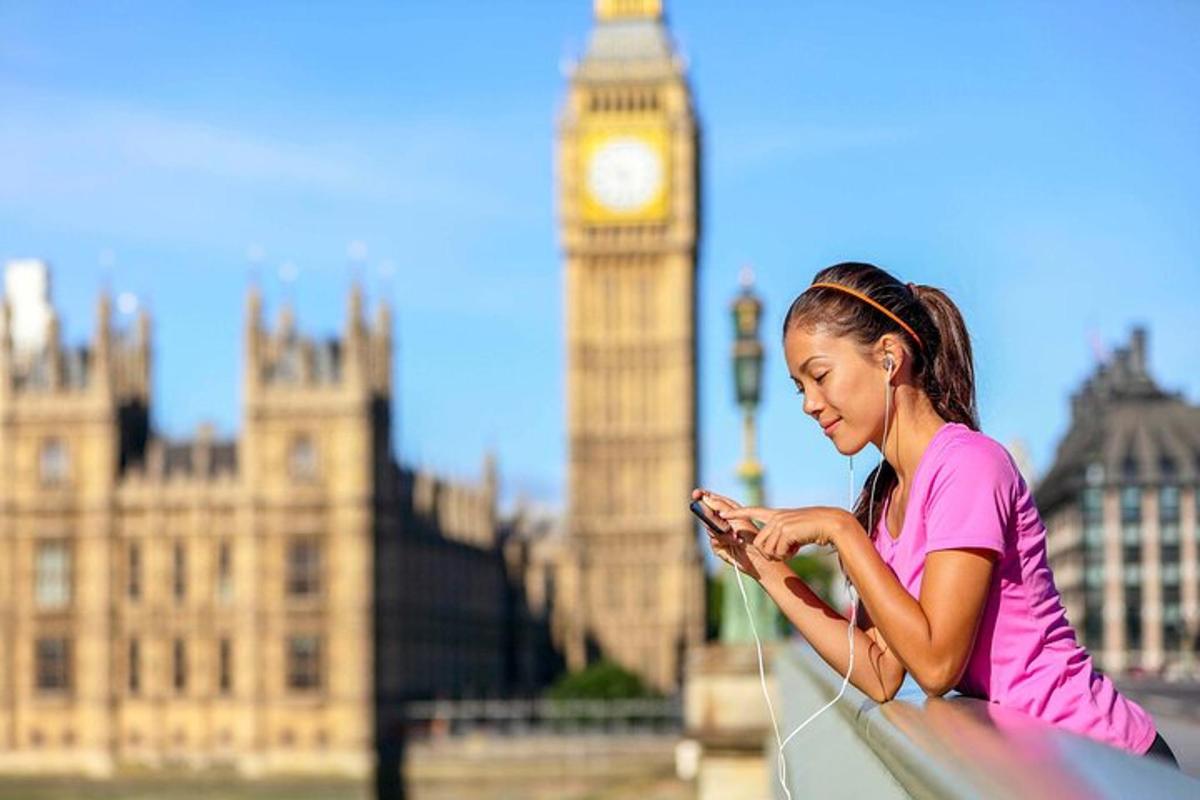 tüdruk vaatab Big Beni ees oma mobiiltelefoni