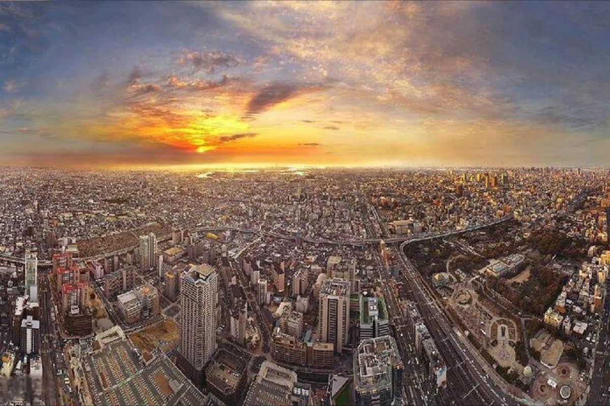 a view of a large city at sunset