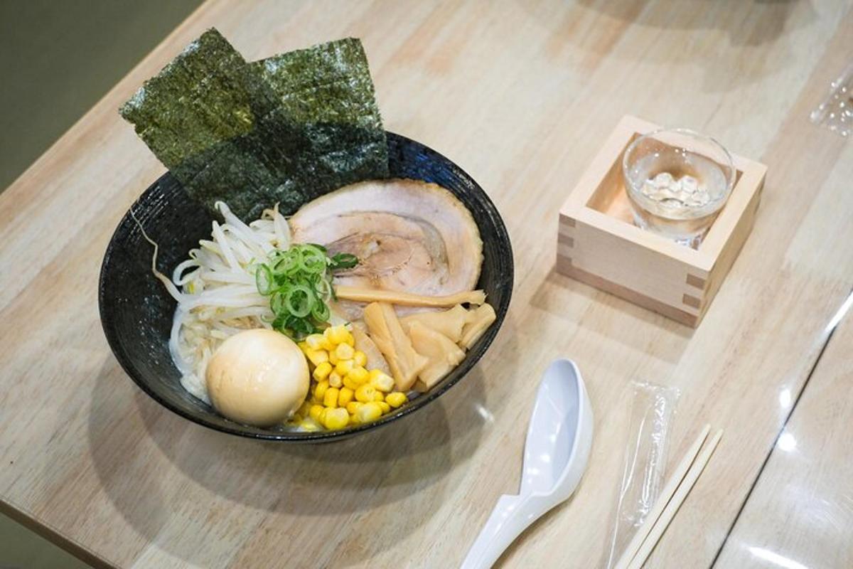 a bowl of food sitting on a wooden table