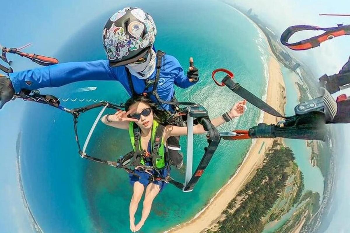 two people are riding a bike in the air