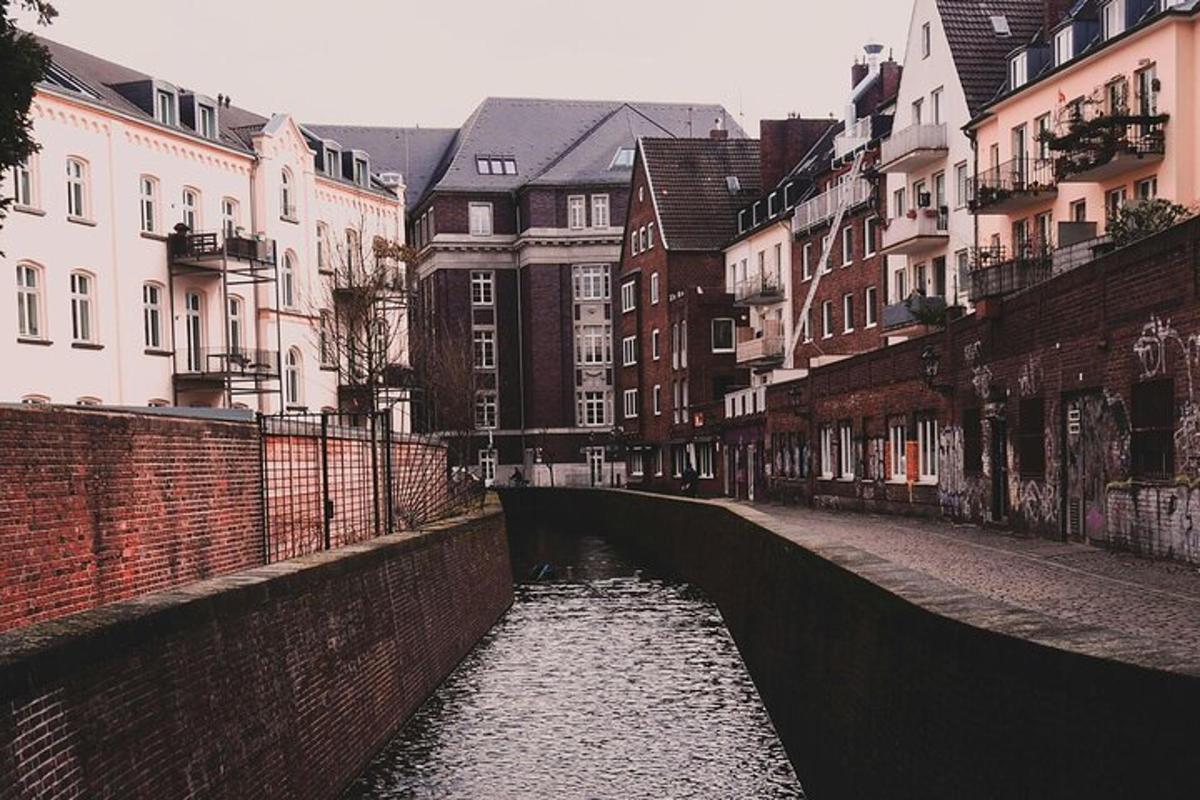 a canal in the middle of a city with buildings