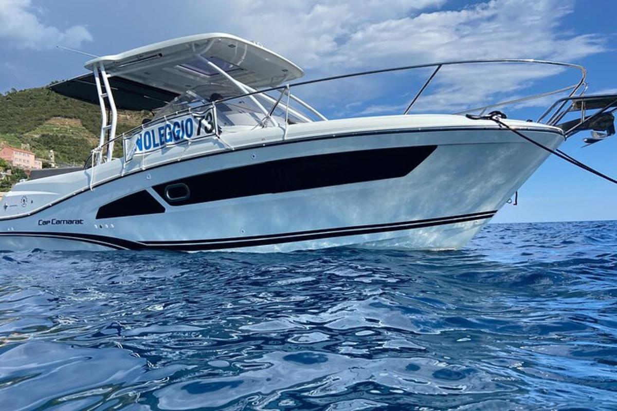 a white boat in the water on the ocean