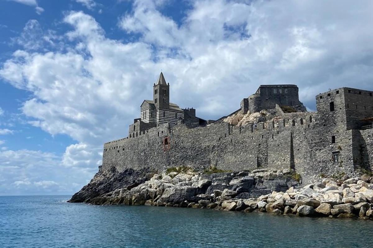 a castle on a rocky island in the water