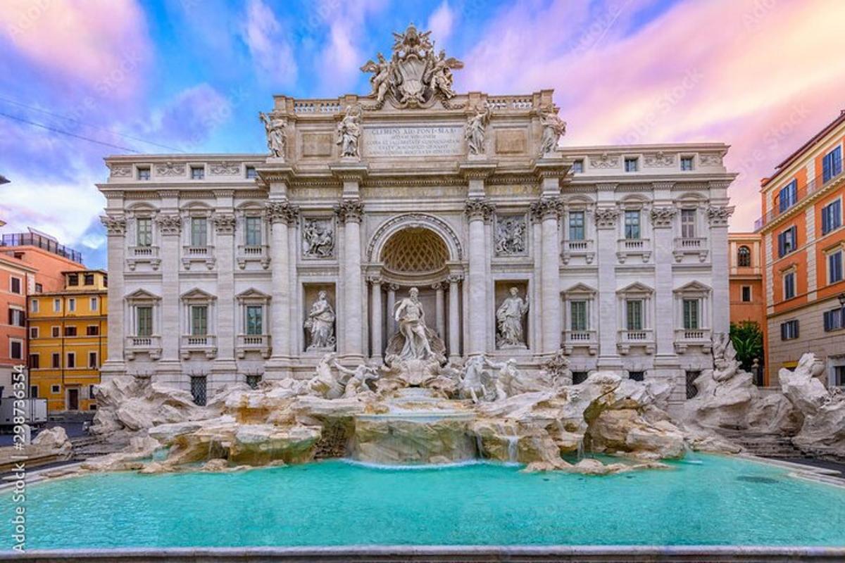 a large building with a fountain in front of it