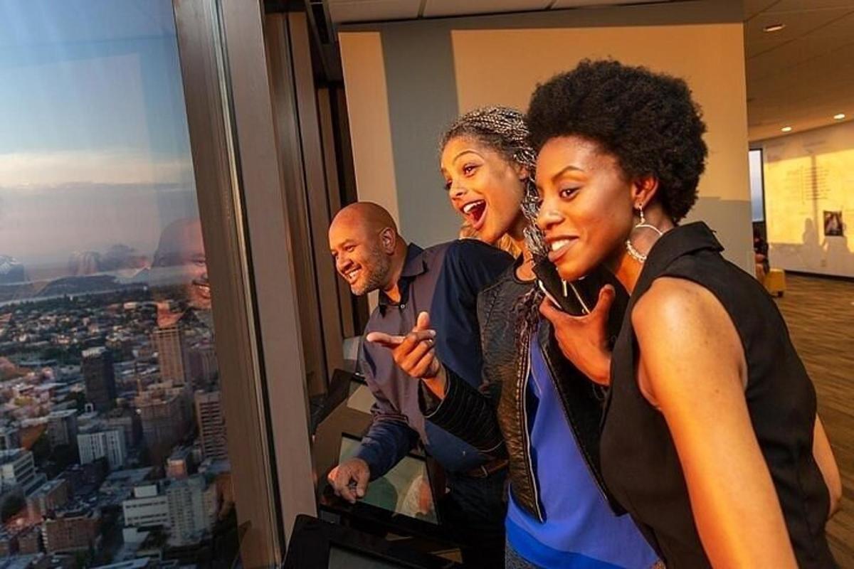 a group of people standing in front of a window