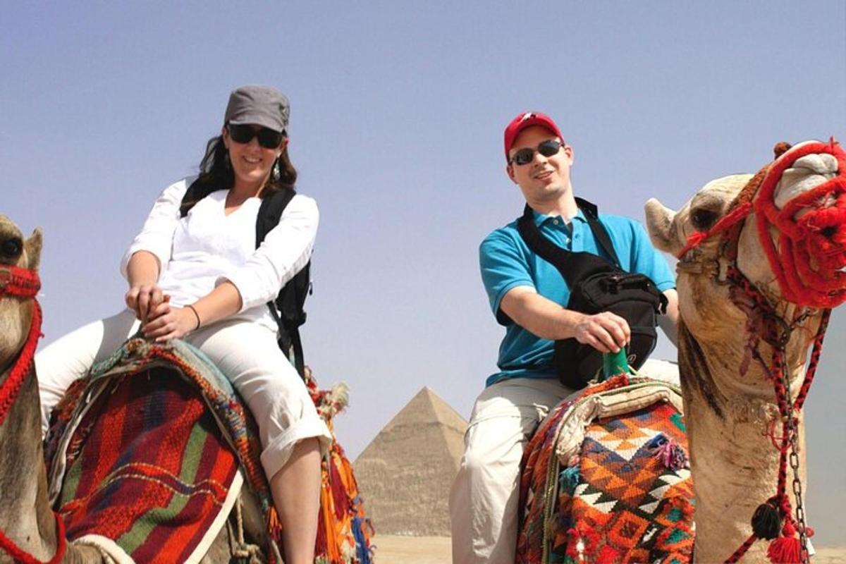 a man and a woman riding on the backs of pyramids