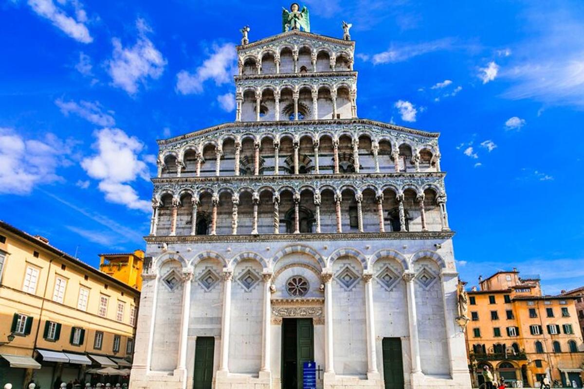 a tall tower with a statue on top of it