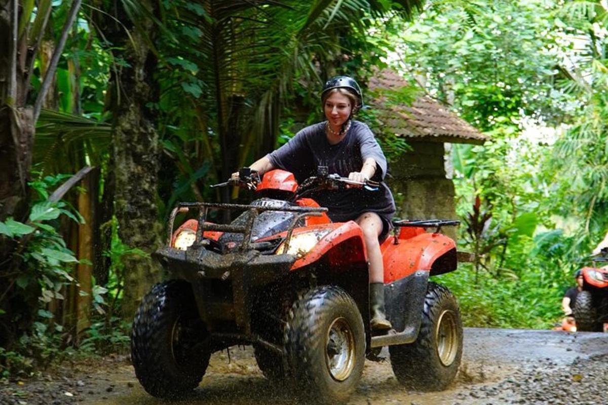 isang babaeng nakasakay sa isang four wheeler sa kagubatan