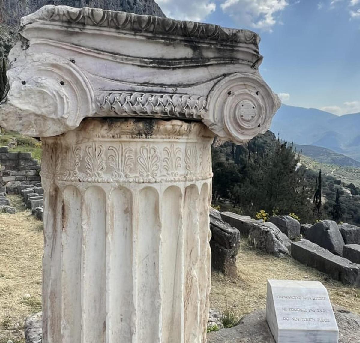a stone column on top of a hill