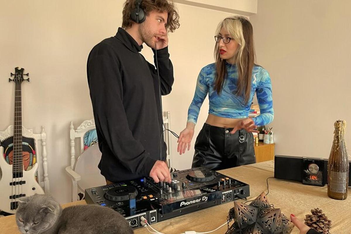 a man and a woman standing next to a stove
